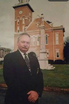 Sheriff Hannan stands for a photo in front of the Bibb County Courthouse in Centreville, AL.